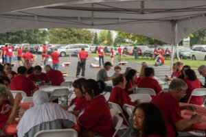 Micro Control Company employees enjoying games at the annual summer picnic.