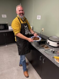 MCC managers serving pancakes at the annual Managers’ Breakfast.