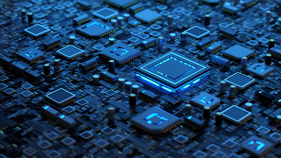 Close-up of a dark blue computer circuit board with illuminated processor chips and electronic components.