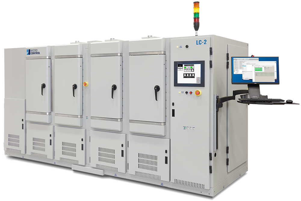 Micro Control LC-2 industrial testing system with four large climate chambers, a control screen, and an attached computer workstation.