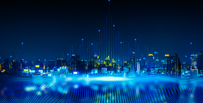 City skyline at night with digital light streaks rising from the buildings and glowing blue data lines in the foreground.