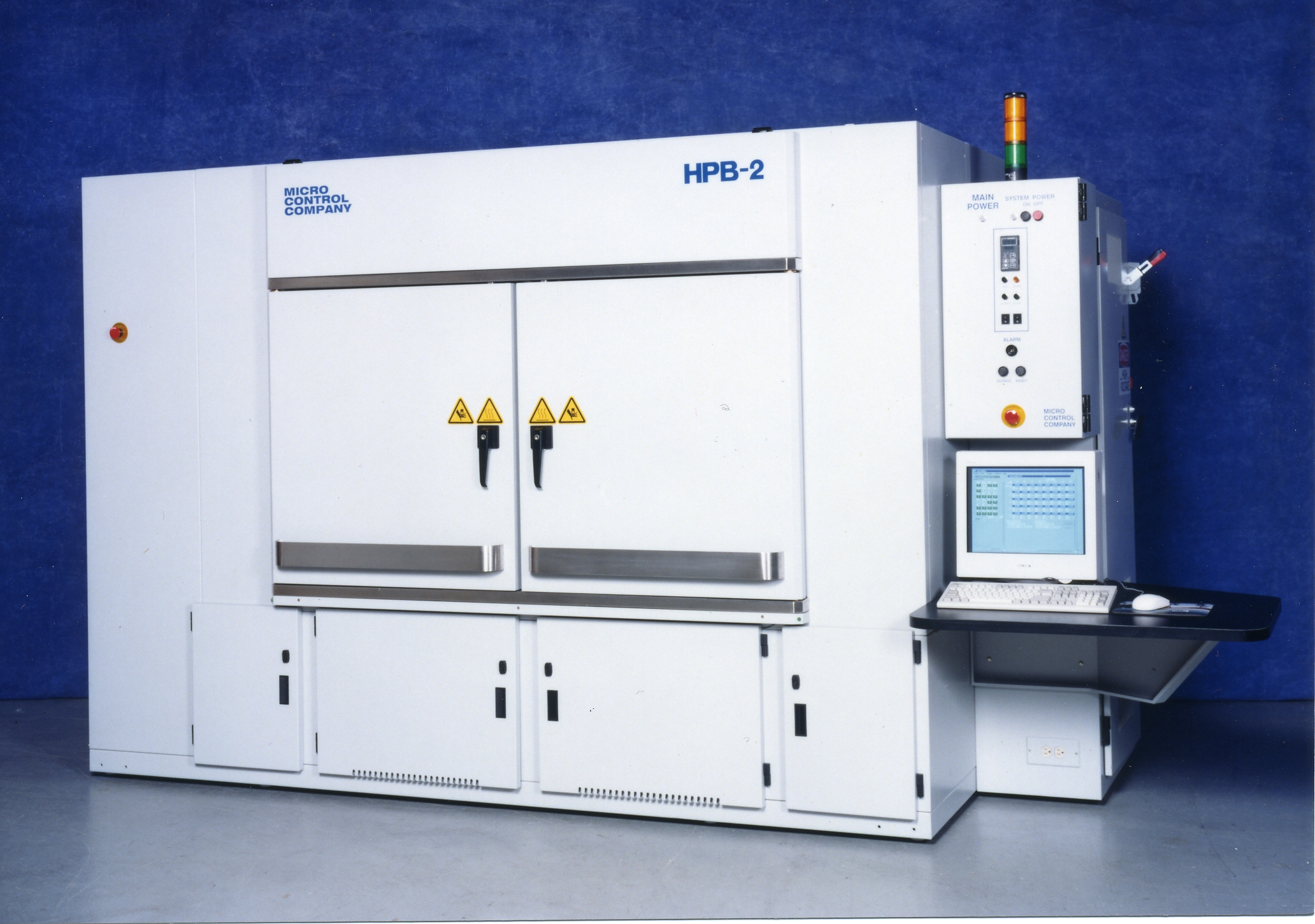 Micro Control Company HPB-2 industrial test chamber with a control panel, computer monitor, and keyboard.